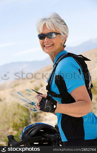 Senior woman reading map
