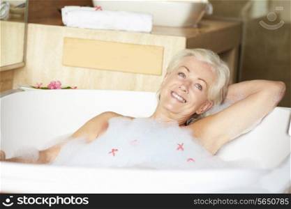 Senior Woman Relaxing In Bubble Bath
