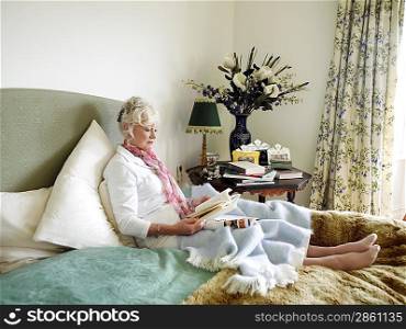 Senior Woman Relaxing with a Book