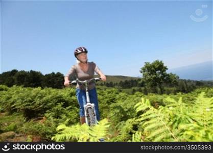 Senior woman riding mountain bike