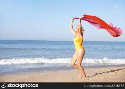 Senior woman running on beach