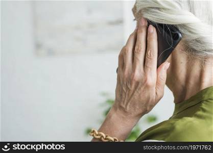 senior woman s hand using cellphone. High resolution photo. senior woman s hand using cellphone. High quality photo