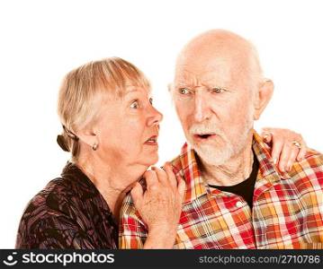 Senior woman sharing information with skeptical man