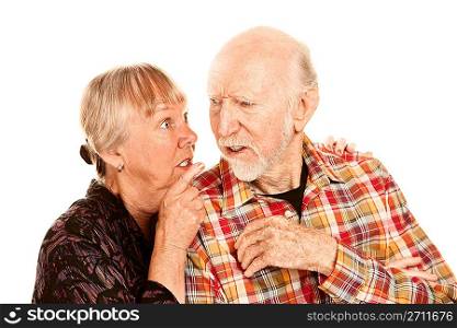 Senior woman sharing information with skeptical man