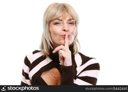 Senior woman showing shh gesture