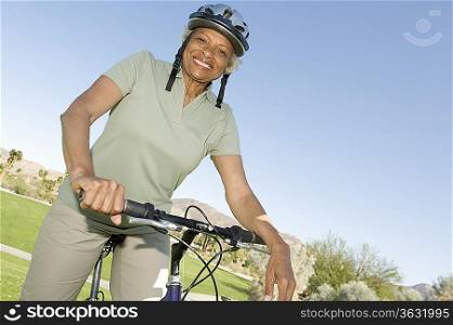 Senior woman sits on mountainbike