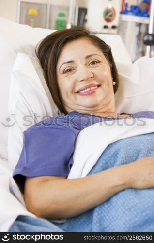 Senior Woman Smiling,Lying In Hospital Bed