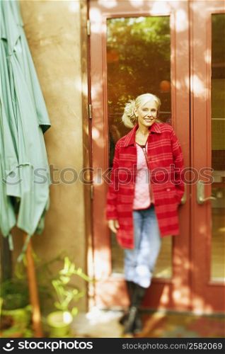 Senior woman standing and smiling