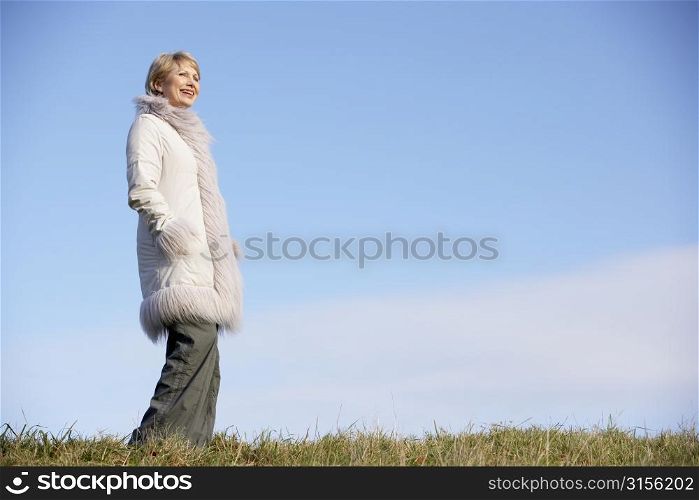 Senior Woman Standing In Park