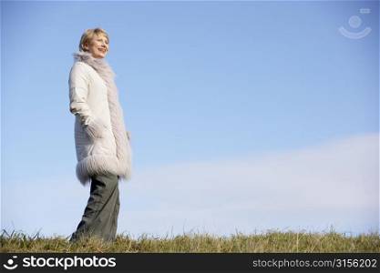 Senior Woman Standing In Park