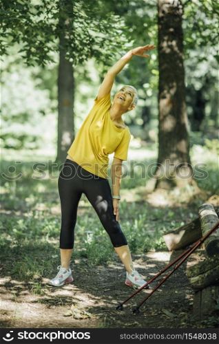 Senior woman stretching after a outdoor walking exercise. Senior Woman Stretching After a Walking Exercise