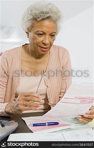 Senior Woman Studying Home Finances