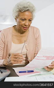 Senior Woman Studying Home Finances