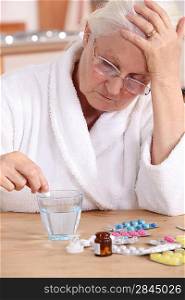 senior woman taking her pills