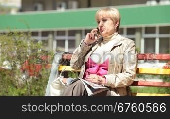 Senior woman talking on cellphone outdoors