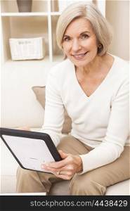 Senior woman using a tablet computer at home