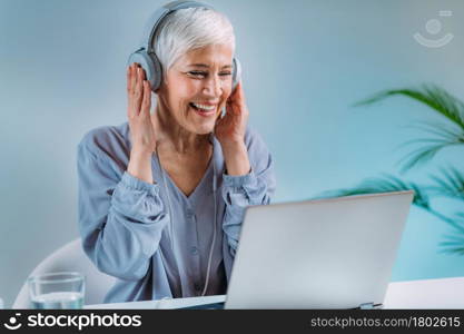 Senior Woman Using Laptop, Having Video Call.. Senior Woman on Video Call.