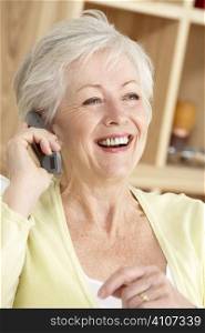 Senior Woman Using Phone At Home