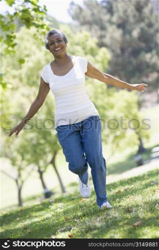 Senior woman walking in park
