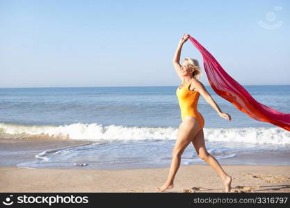 Senior woman walking on beach