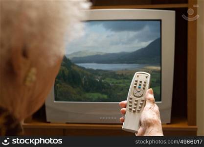 Senior woman watching television