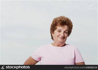 Senior woman wearing a pink t-shirt