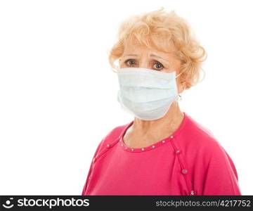 Senior woman wearing a surgical mask to protect from a health epidemic. Isolated on white.