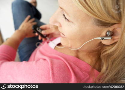 Senior woman wearing earphones