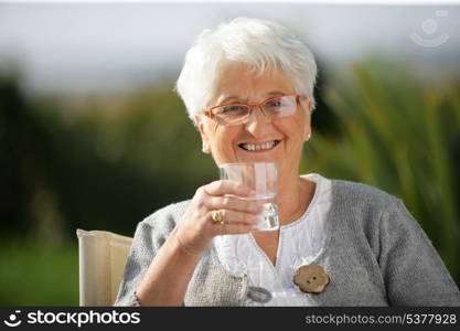 Senior woman with a glass of water
