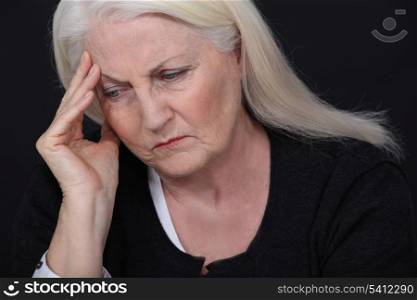 Senior woman with a headache