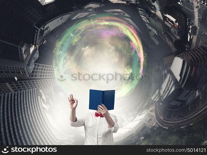 Senior woman with book. Senior woman with opened book against her face showing ok gesture