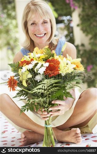 Senior Woman With Bunch Of Flowers