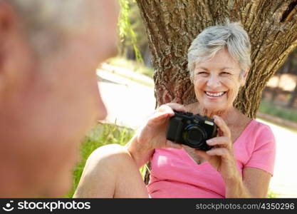 Senior woman with camera