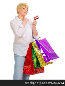 Senior woman with credit card and bags isolated