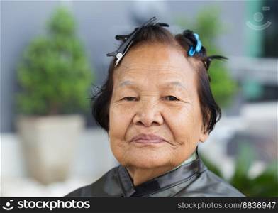senior woman with hairpin on her hair