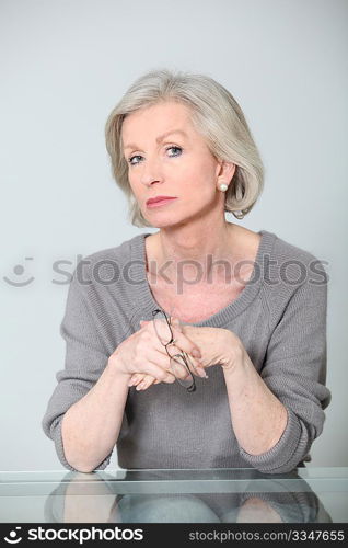 Senior woman with unconcerned expression