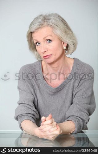 Senior woman with unconcerned expression