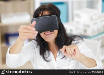 senior woman with virtual headset or 3d glasses
