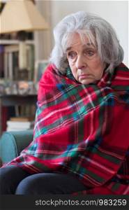 Senior Woman Wrapped In Blanket Unable To Afford Heating Bills