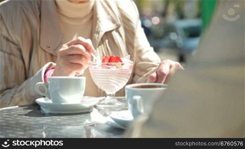 Senior Women Enjoying Dessert At Outdoor Cafe