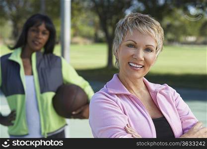 Senior women on outdoor basketball court, portrait