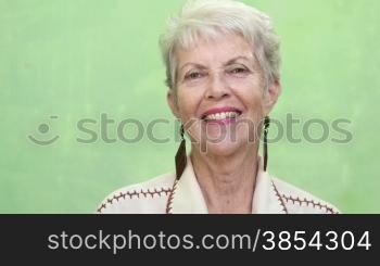 Senior women, portrait of elderly caucasian lady looking and smiling at camera. Sequence