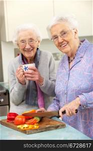 Senior women preparing meal together