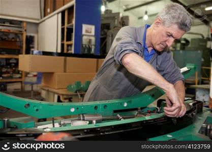 senior worker on factory floor in the manufacturing industry