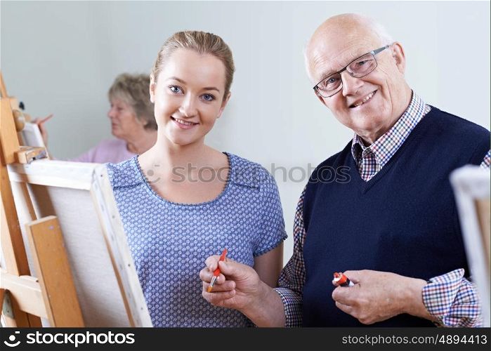 Seniors Attending Painting Class With Teacher