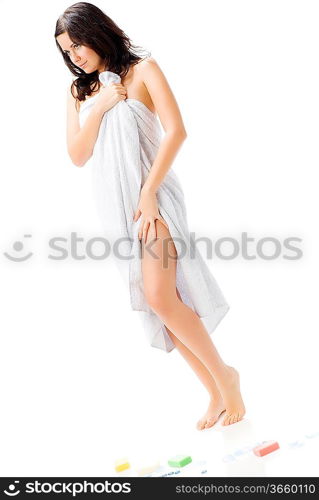 sensual and cute young brunette wearing a white towel playing with the camera and making sexy pose