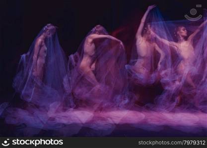 sensual and emotional dance of beautiful ballerina through the veil . photo as art - a sensual and emotional dance of beautiful ballerina through the veil on a dark background. A stroboscopic image of the one model