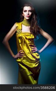 sensual beautiful woman in long yellow dress