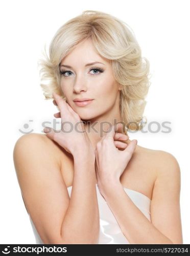 Sensual blond woman with fresh health skin posing on white background