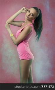 sensual brunette female with perfect body posing with fresh modern style, pink shirt, sexy colorful panties, ponytail and wrist watch